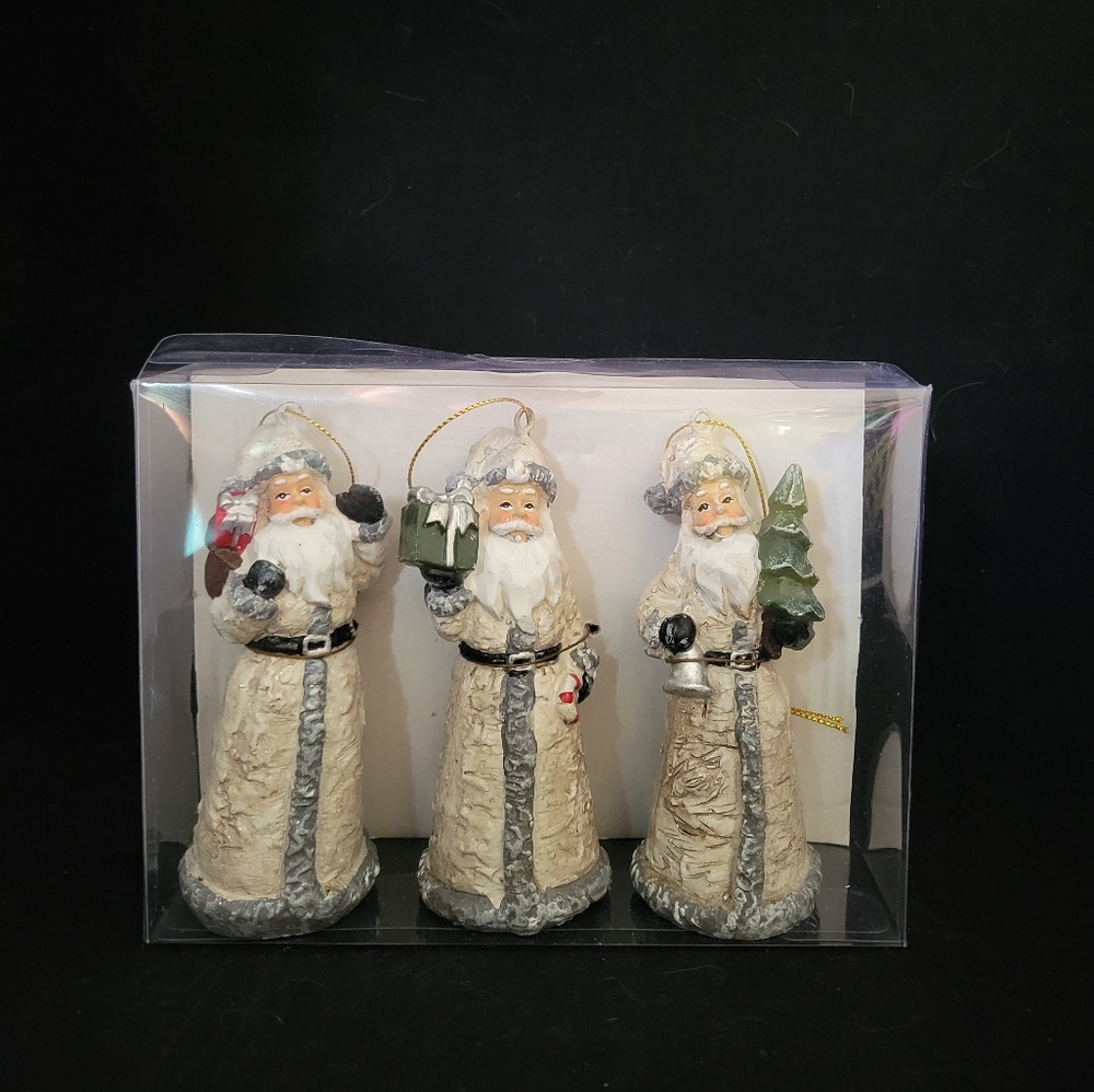 NWT BRAND NEW Original pkg. Set of 3 Resin Santa holiday figurines ornaments.